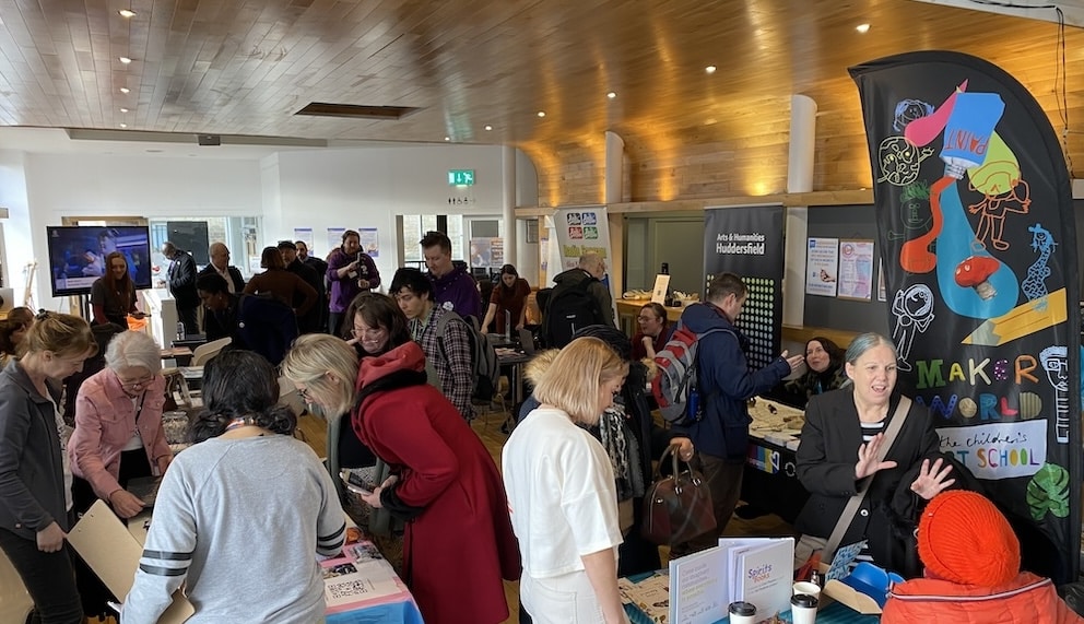 A networking event with people and stalls